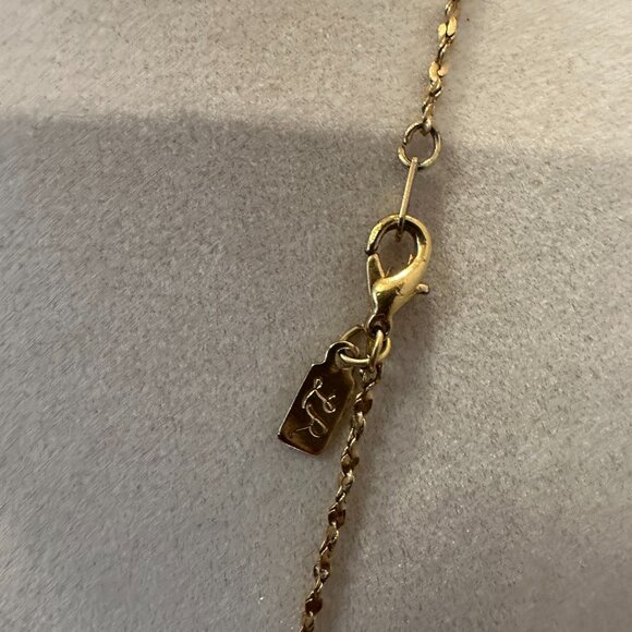 This necklace is a gold-tone with a rhinestone ball pendant. - Picture 4 of 7